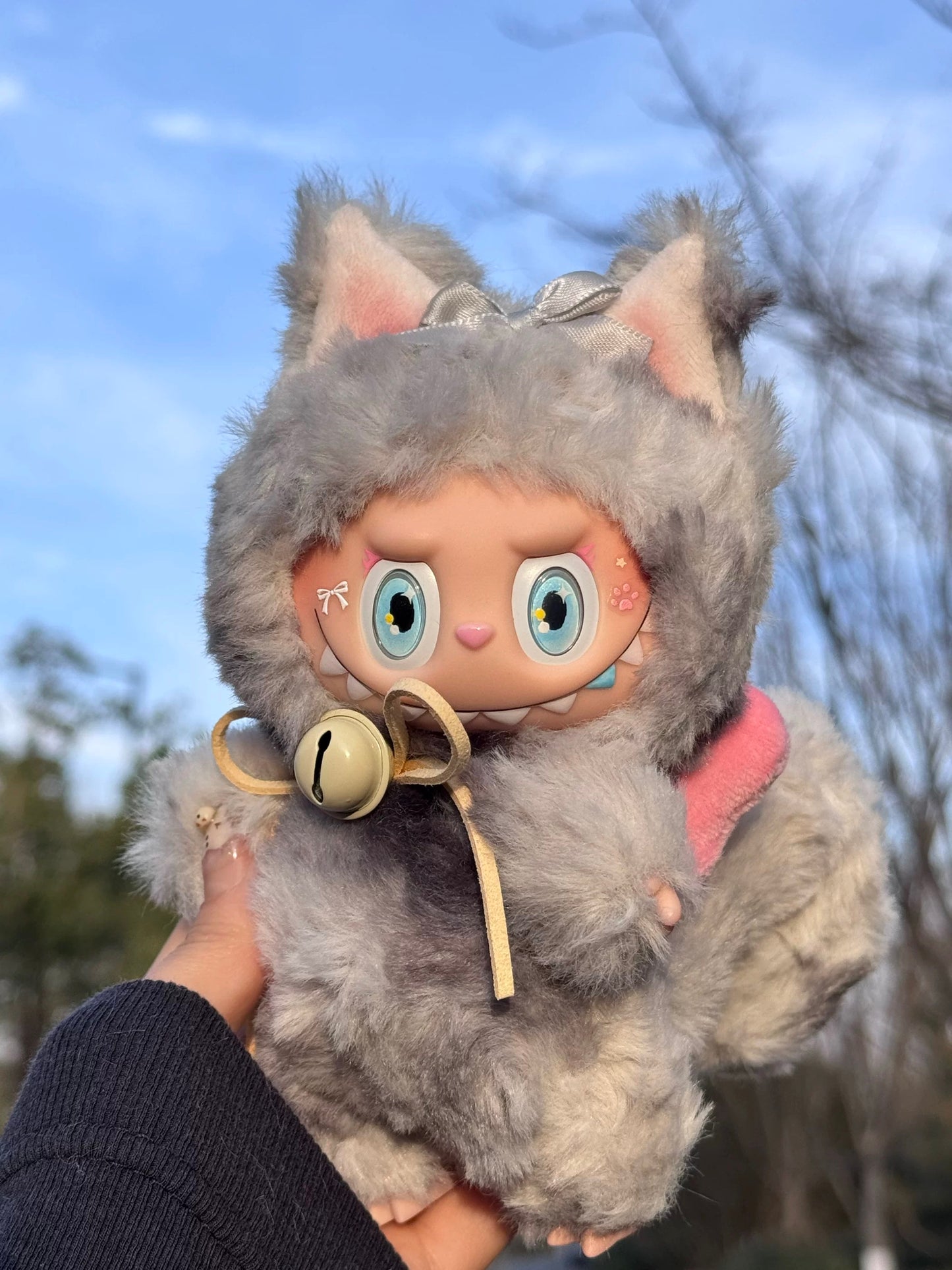 artist crafted labubu with grey tail and bow accessory