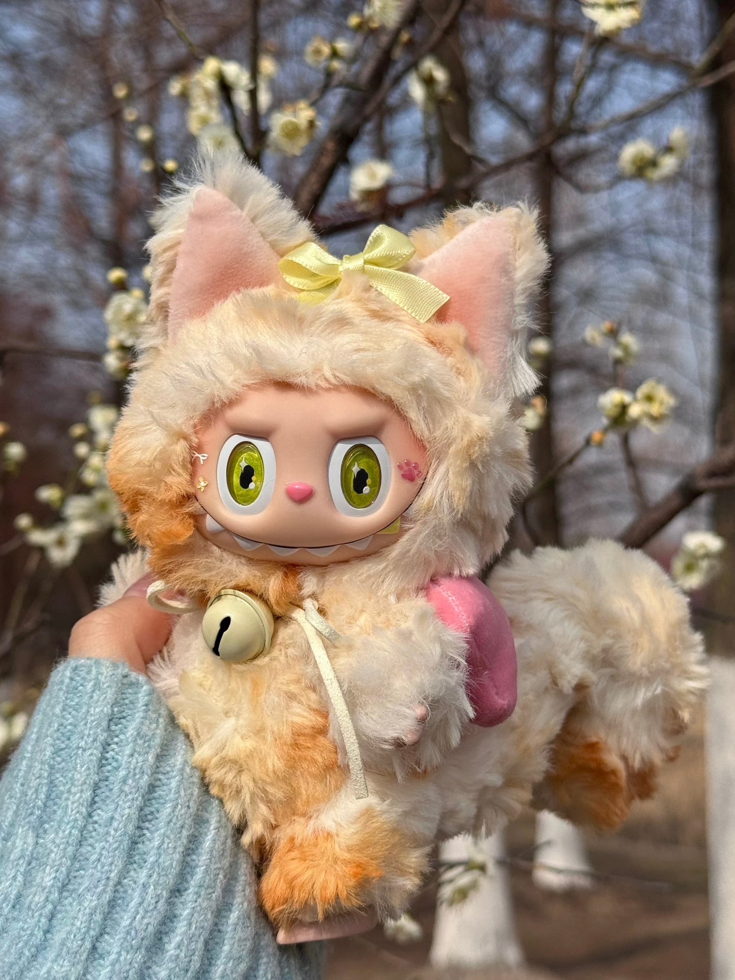 artist-made labubu plush with golden tail and bow