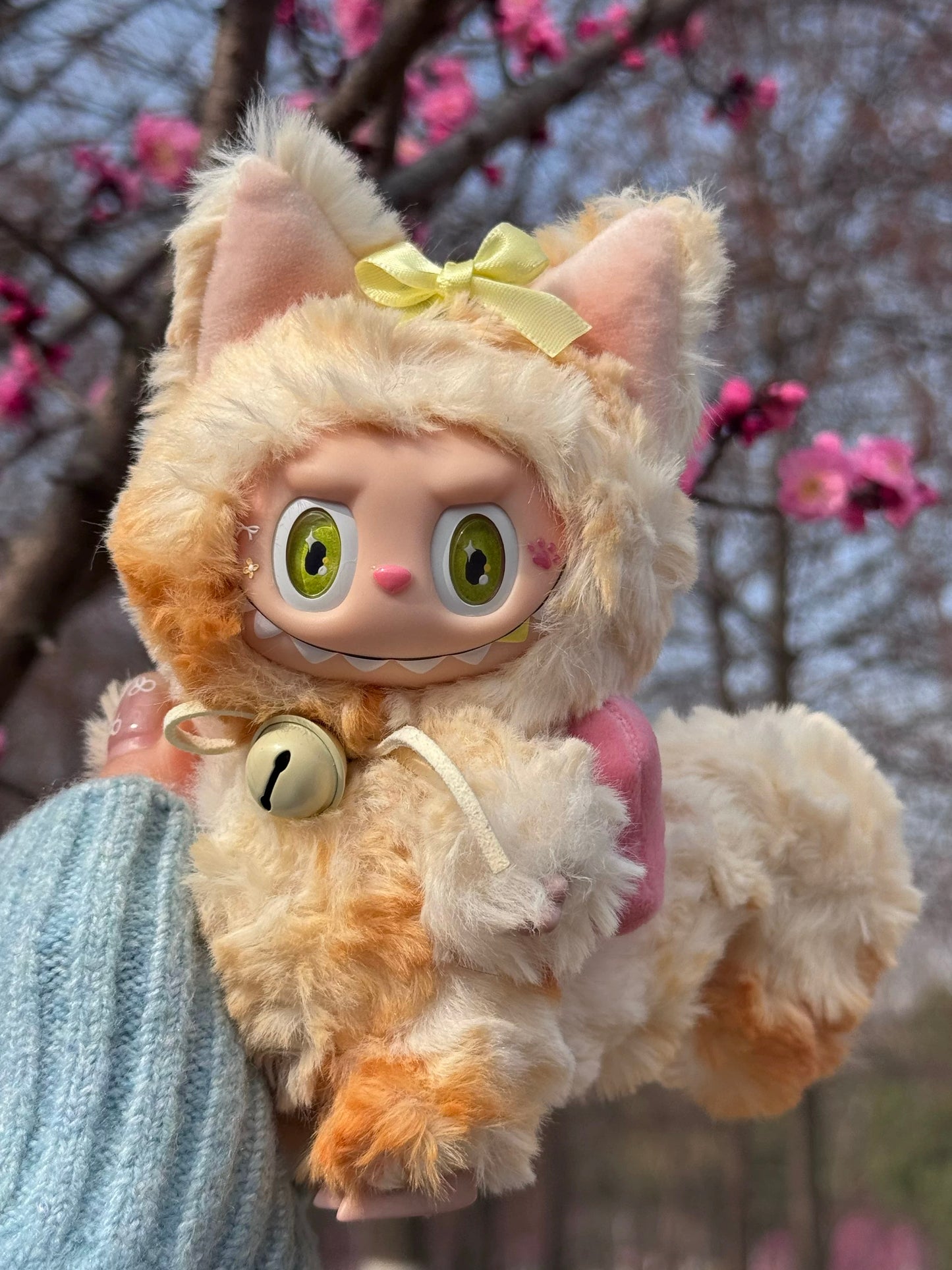 labubu handmade toy with golden tail accessory