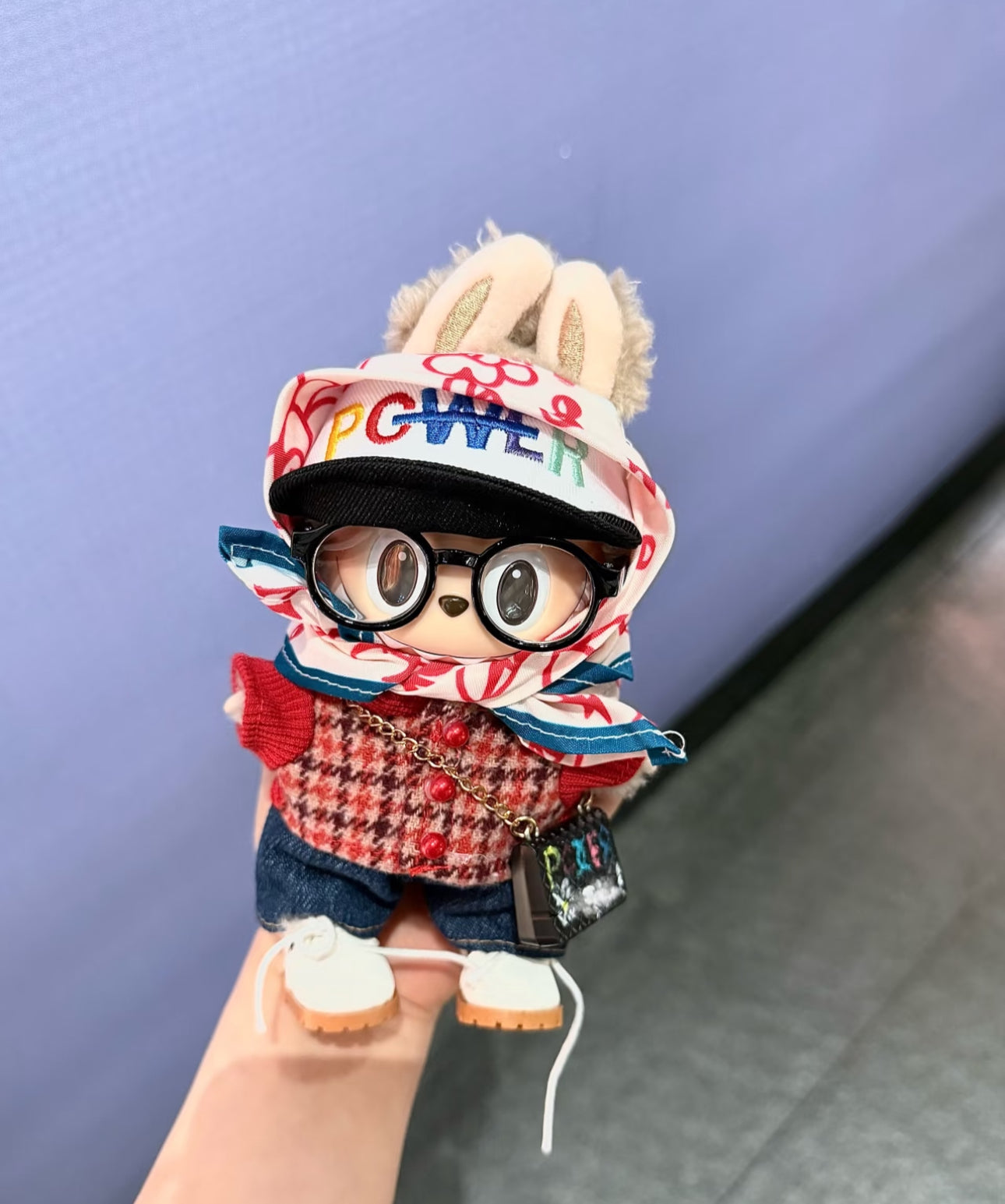 pop mart labubu in G-Dragon streetwear style accessories including scarf and mini bag