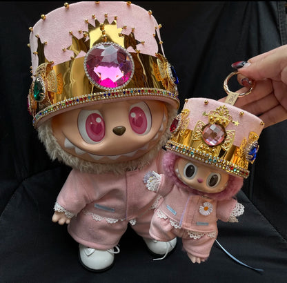 Two Labubu figures wearing pink outfits with a crown, designed to look like a Kpop G-Dragon inspired outfit.