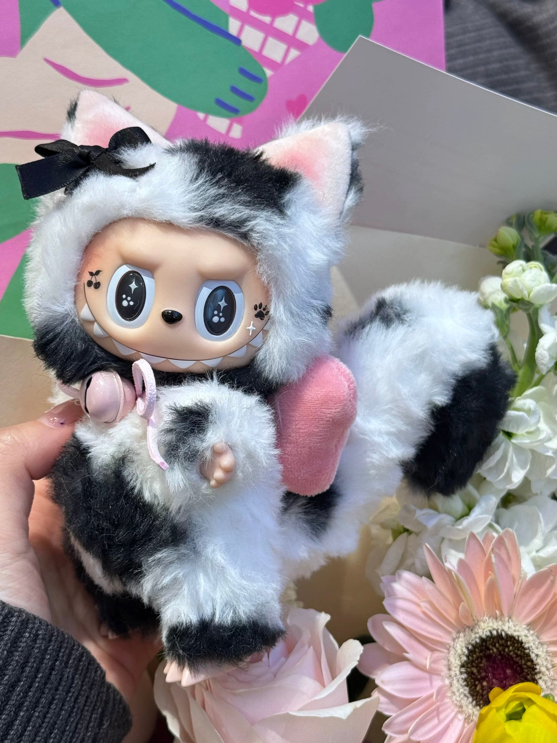 artist crafted labubu toy with monochrome bow accessory