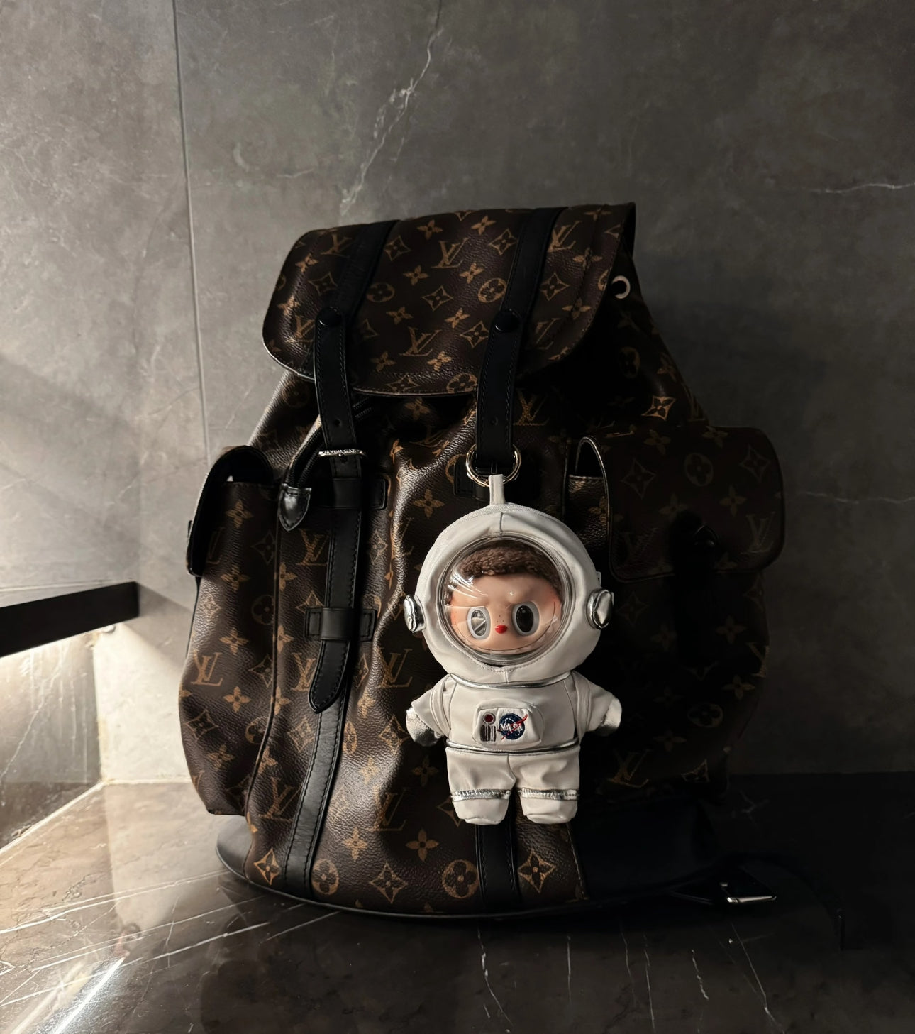 labubu plush figure in miniature astronaut helmet and suit
