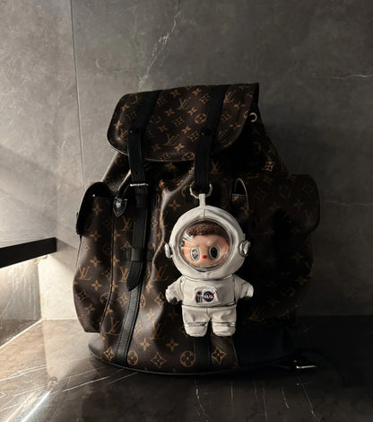 labubu plush figure in miniature astronaut helmet and suit