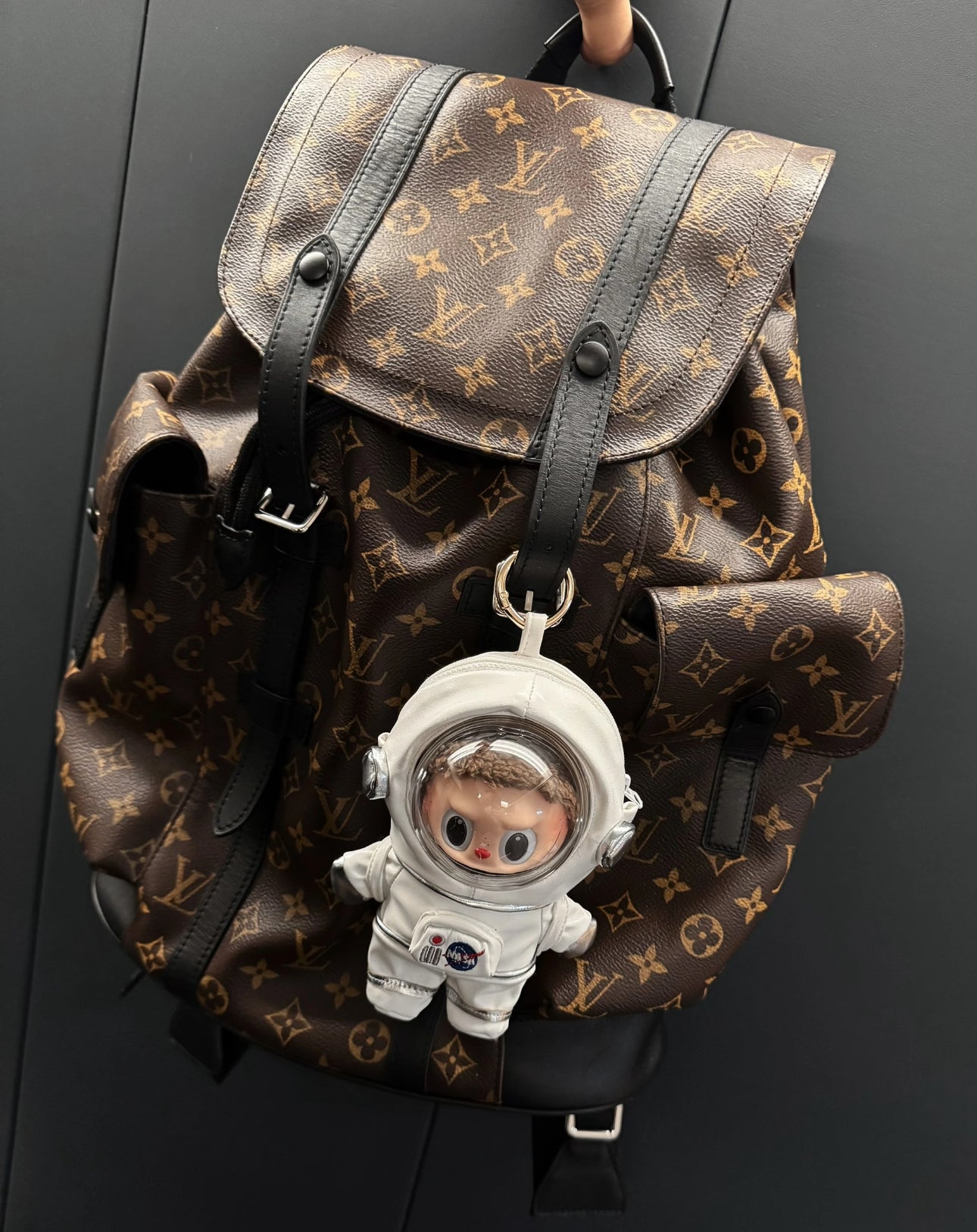 labubu plush figure in miniature astronaut helmet and suit