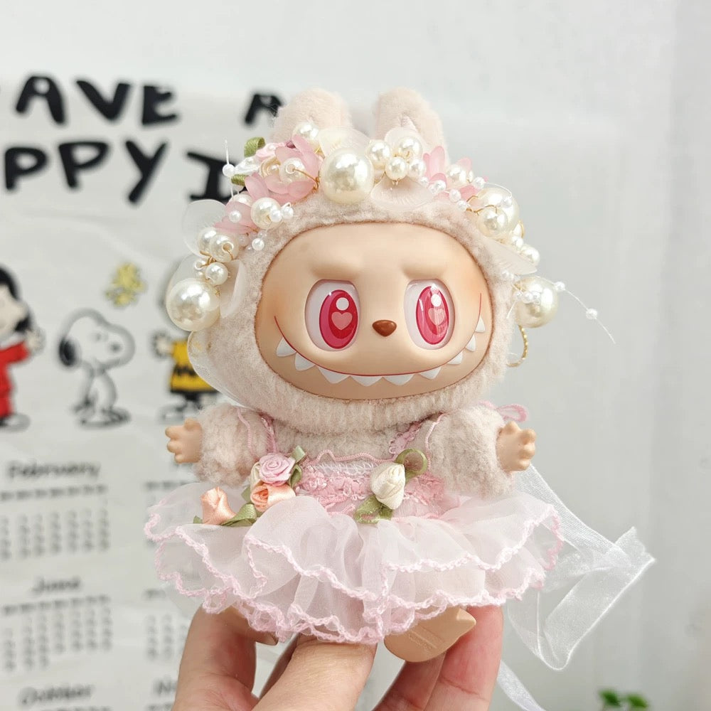 labubu doll in pink wedding dress with lace and pearl headband